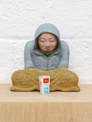 A beggar with a cup